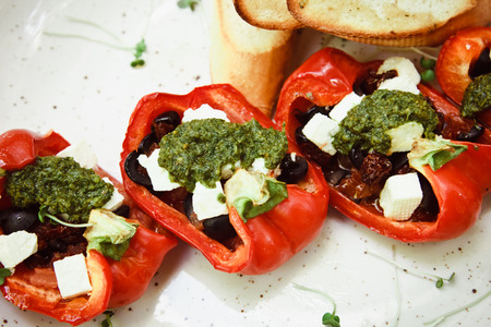 Stuffed peppers roasted with feta cheese and vegetableの写真素材