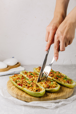 Stuffed zucchini with chicken, tomatoes and onion with cheese crustの写真素材
