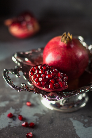 Pomegranate fruit. Pomegranates over black Backgroundの写真素材