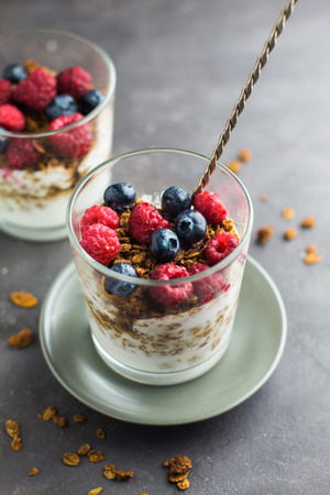 Granola with raspberries and blueberries. The concept of a healthy lifestyle, diet, healthy Breakfastの写真素材
