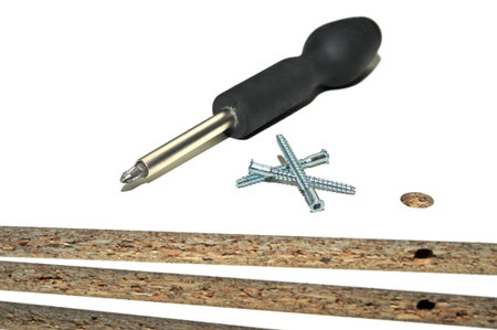 screws and screwdriver on board