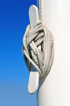 rope tightly tied to white flagpoleの写真素材