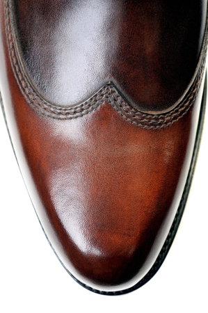glossy brown leather schoe on white background