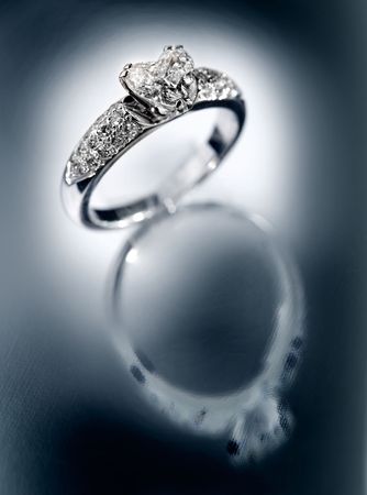 Ring with brilliants on a blue backgroundの写真素材
