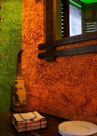 Green and orange interior with mirrorの写真素材
