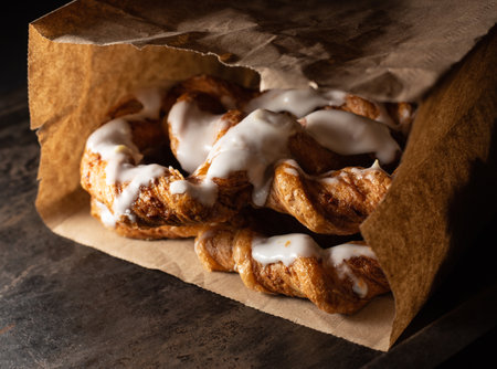 Fresh bakery in craft paper bag. Dark backround.の写真素材