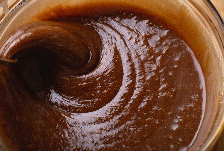 Swirling Gingerbread Cookie Batter in Bowl Baking Process Macroの写真素材