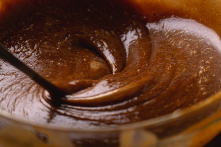 Swirling Gingerbread Cookie Batter in Bowl Baking Process Macro