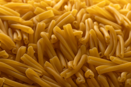Dry Casarecce Pasta Background, Top View of Uncooked Italian Noodlesの写真素材