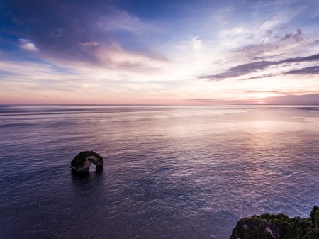 Sunset aerial view Bali ocean. Red sky and amazing cliff. View by drone.の写真素材