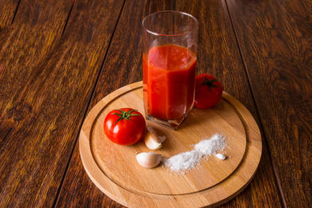 Fresh tomatoes and tomato juiceの写真素材
