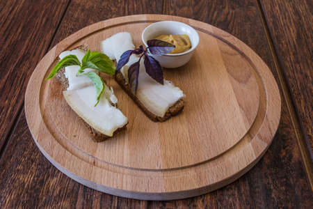 Pork fat sandwiches, mustard and Basilの写真素材