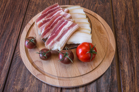 Slicing different types of lettuce fresh tomatoes