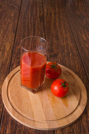 Tomato juice and fresh tomatoesの写真素材