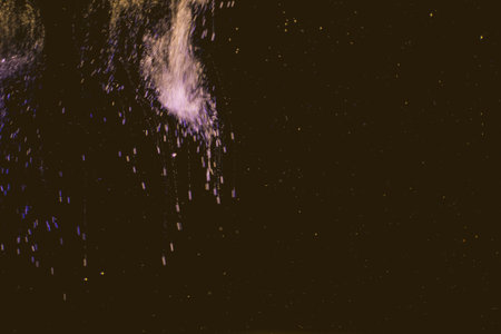 Dance of small gas bubbles in a colored liquid. Bubbles of gas in the wine. Carbonated Christmas...