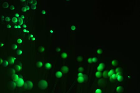 Glowing colored blurred dots. Colored fantasies. Bokeh. Abstract colored background. Glowing fiber optic filaments.の写真素材