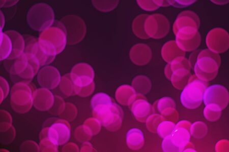 Glowing colored blurred dots. Colored fantasies. Bokeh. Abstract colored background. Glowing fiber optic filaments.の写真素材