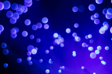 Glowing colored blurred dots. Colored fantasies. Bokeh. Abstract colored background. Glowing fiber...