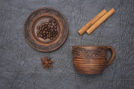 Homemade cup and saucer made of glazed clay.の写真素材