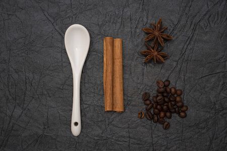 White glazed porcelain coffee spoon on artificial leather background.の写真素材