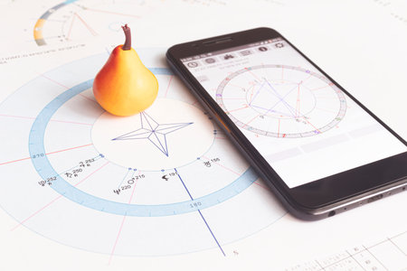 The desktop of an astrologer. Gadgets help the modern Oracle to make calculations. The magical...