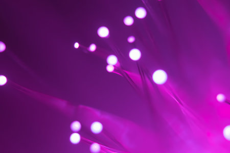 Abstract background. Fantastic fancy plants with colored branches with luminous dots at the ends. Lamp from a panicle of optical fibers on a dark background.の写真素材