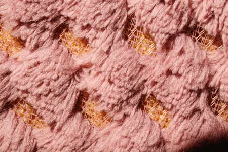Close-up fabric texture. Fancy curls of colored fabric fibers.
