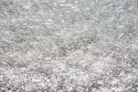Close-up of fresh snow that has just fallen. Separate shiny stars of snowflakes. The texture of a...