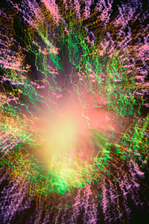 Big explosion. Expanding universe. Fireworks explosion. Abstraction. Multi-colored curly threads scattering from the center. Illuminated optical fiber.の写真素材