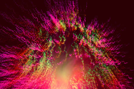 Big explosion. Expanding universe. Fireworks explosion. Abstraction. Multi-colored curly threads scattering from the center. Illuminated optical fiber.の写真素材