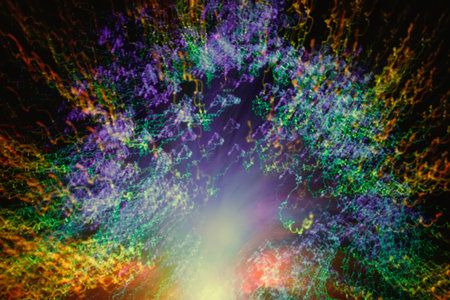 Big explosion. Expanding universe. Fireworks explosion. Abstraction. Multi-colored curly threads scattering from the center. Illuminated optical fiber.の写真素材