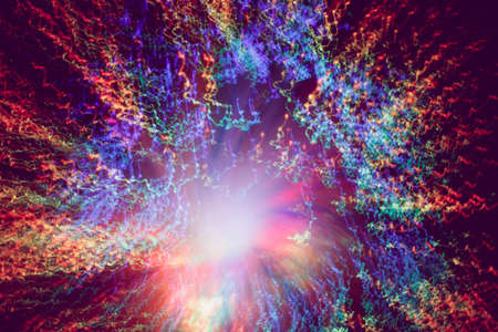 Big explosion. Expanding universe. Fireworks explosion. Abstraction. Multi-colored curly threads scattering from the center. Illuminated optical fiber.の写真素材