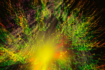 Big explosion. Expanding universe. Fireworks explosion. Abstraction. Multi-colored curly threads scattering from the center. Illuminated optical fiber.の写真素材