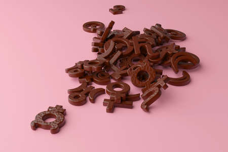 Chocolate-covered cookies in the form of astrological signs of the planets on a pink background.の写真素材