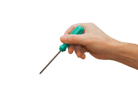 A metal screwdriver with a plastic handle in a man's hand close-up. Tool in the hand of the master. Isolate on a white background.の写真素材