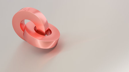 Abstract copper rings on reflective grey surface.の写真素材