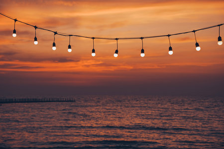 light bulb on the background of sea sunsetの写真素材
