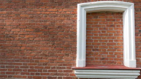 Texture background. White frame on the red brick wallの写真素材