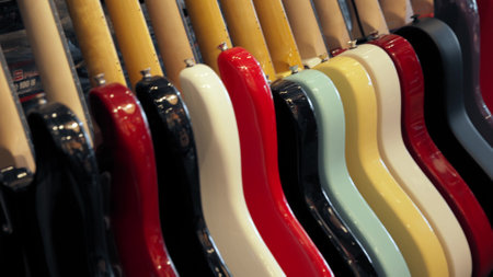 Guitar shop, colorful electric guitar bodies in a row and classical guitar sampleの写真素材