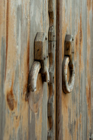 elements of old wooden doors with knobs instead of the rings
