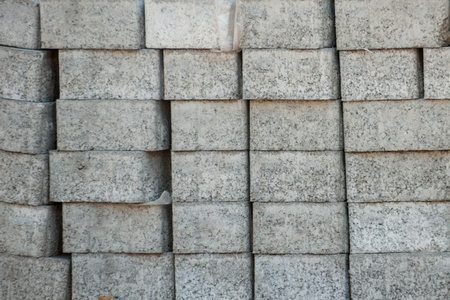 Laying colored paving tiles outside in the park