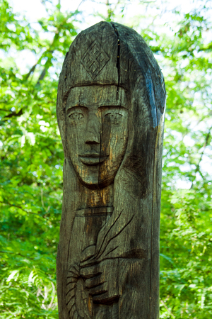 Holy old wooden statue of a woman's faceの写真素材