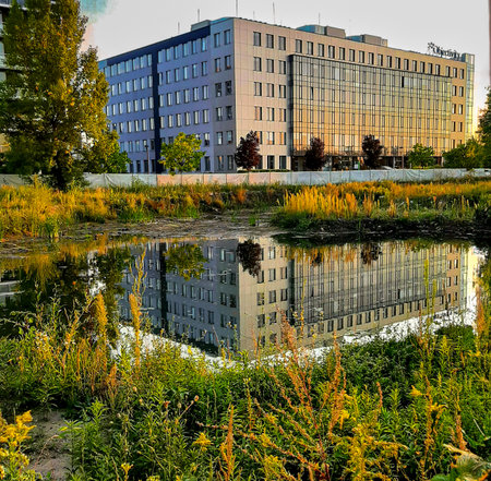 Reflection of the building in the water. Moscow, Russia.の写真素材