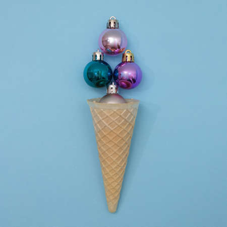 Ice cream from New Year's decorations in a cone. Minimal scene, flat lay.の写真素材