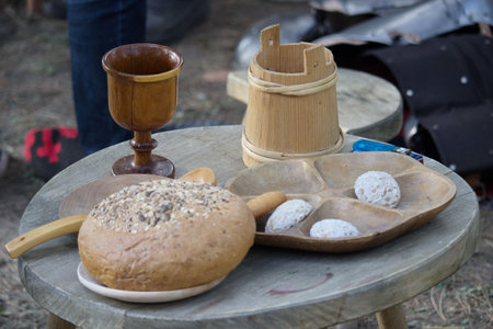 Freshly baked bread and wooden items on display.の写真素材