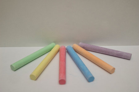 A myriad of vibrant hues from an array of chalks come together to create a whimsical and imaginative stationery scene, inviting the viewer to dream up countless possibilities insideの写真素材
