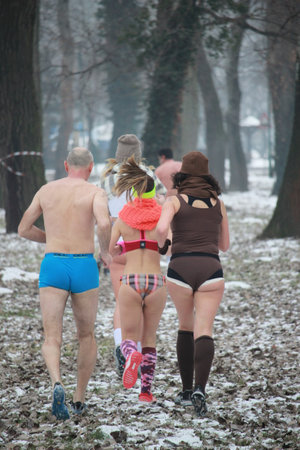 Runners compete wearing minimal clothing in winter.の写真素材