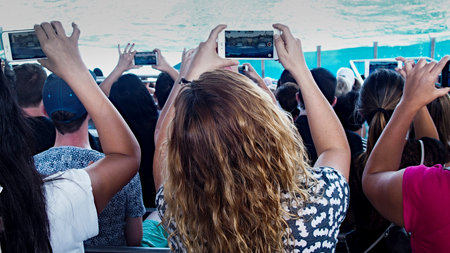 photographing spectators