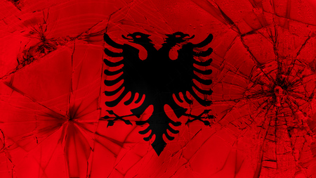 Flag of Albania, Albanian flag painted on broken glassの写真素材