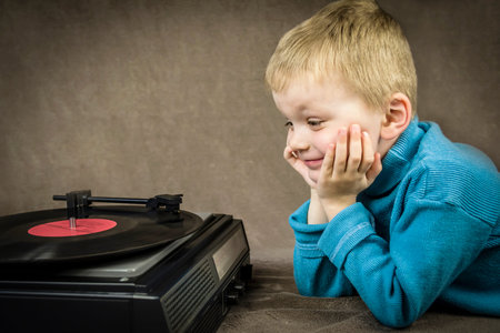 boy listening to player